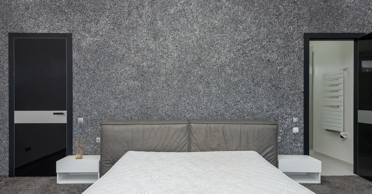 Dormitorio contemporáneo con decoración minimalista y tonos neutros.